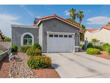 Charming single-story home with a well-maintained yard and attached two-car garage at 6536 Pleasant Plains Way, Las Vegas, NV 89108