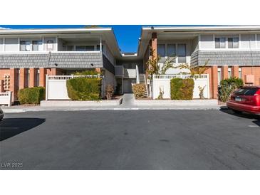 Inviting two-story condo with well-maintained landscaping and convenient parking at 668 Oakmont Ave # 1715, Las Vegas, NV 89109