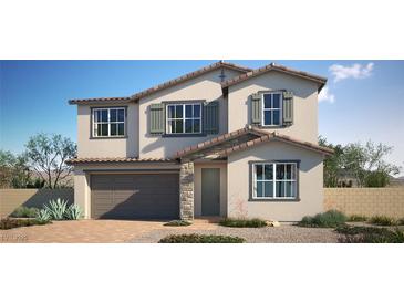 Two-story home featuring a neutral color scheme, shuttered windows, tile roof, and a two car garage at 774 Cloud Creek St, Henderson, NV 89011