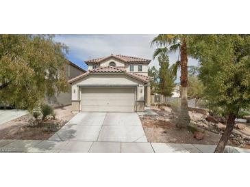 Charming two-story home featuring a two-car garage and landscaped front yard, creating a welcoming curb appeal at 3128 Spring City Ave, North Las Vegas, NV 89081