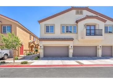 Beautiful two-story home with attached garages, neutral paint, and tile roof at 4725 Blaise Ave # 103, North Las Vegas, NV 89084
