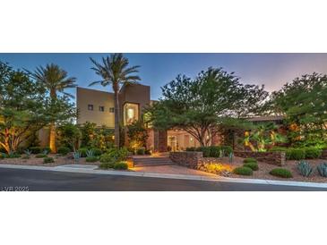 Contemporary home featuring desert landscaping, stone accents, and ample natural light at 583 Saint Croix St, Henderson, NV 89012