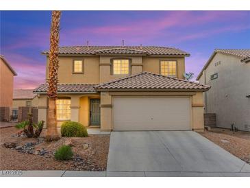 Charming two-story home featuring a well-manicured front yard with a two car garage at 3524 Colby Creek Ave, North Las Vegas, NV 89081