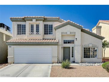 Charming two-story home with a well-maintained lawn and a two-car garage at 7813 Falconwing Ave, Las Vegas, NV 89131