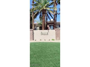 The Falls community entrance welcomes residents with lush landscaping and elegant signage at 9050 W Warm Springs Rd # 1092, Las Vegas, NV 89148