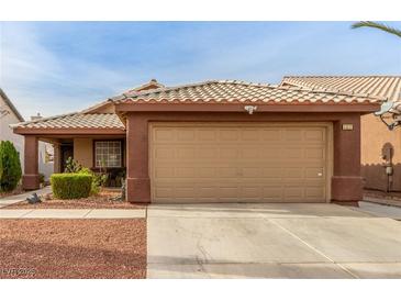 Inviting single-story home featuring a desert-friendly landscape and a two-car garage at 3323 Bay Horse Ct, North Las Vegas, NV 89032