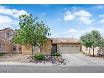 Charming single-story home featuring a neutral color scheme, well-maintained landscaping, and a two-car garage at 3752 Calle De Rio Ave, Las Vegas, NV 89115