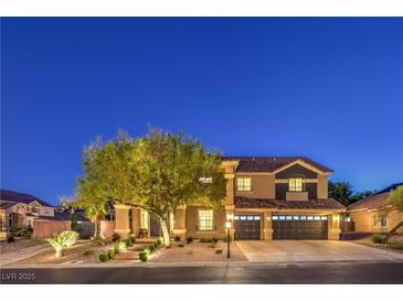 Charming two-story home featuring a three-car garage and well-manicured landscaping at 4737 Barcelona Ridge Ct, Las Vegas, NV 89129