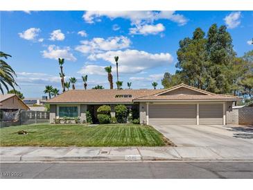 Charming single-story home with well-manicured lawn and a spacious two-car garage at 3361 Iberia St, Las Vegas, NV 89146