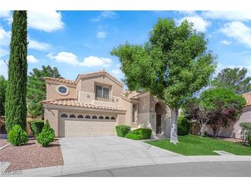 Charming two-story home featuring a well-manicured lawn, and a spacious three car garage at 2417 Chestnut Hill St, Las Vegas, NV 89134