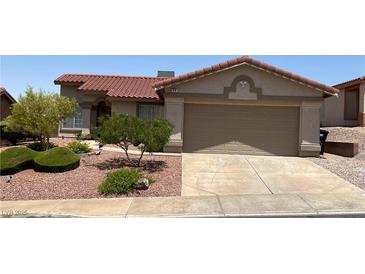 Charming single-story home featuring a red tile roof and well-maintained desert landscaping at 416 Richgold St, Henderson, NV 89012