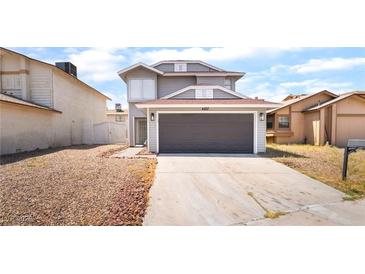 Two-story home featuring a gray exterior and a two-car garage at 4657 Curdsen Way, Las Vegas, NV 89110