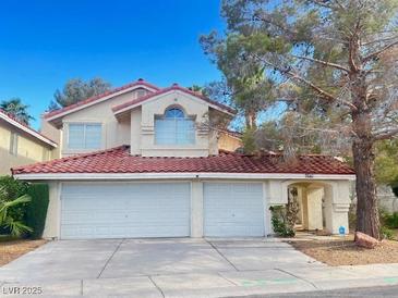 Charming two-story home featuring a two-car garage and tile roof in a quiet neighborhood at 7641 Tortola Bay Ln, Las Vegas, NV 89128