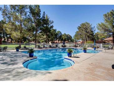 Resort-style pool area with ample seating and lush landscaping, perfect for relaxation and community enjoyment at 2851 S Valley View Blvd # 1039, Las Vegas, NV 89102