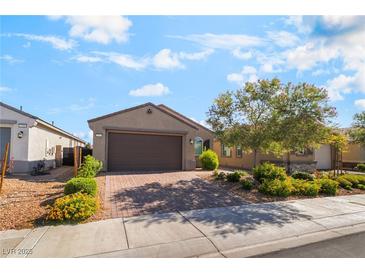 Charming single-story home with a two-car garage and a beautifully landscaped front yard at 3782 Neblina Dr, Henderson, NV 89052