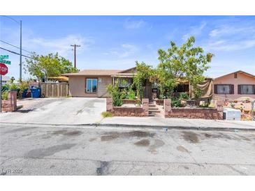 Charming single-story home featuring a well-maintained front yard and a welcoming facade at 4606 Powell Ave, Las Vegas, NV 89121