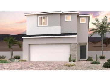 This is a two-story home with neutral colors, a two-car garage, desert landscaping, and a beautiful blue sky at 8538 W Agate Ave, Las Vegas, NV 89113