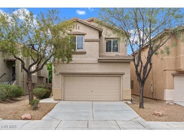 Charming two-story home featuring a neutral color palette, well-maintained landscaping, and an attached two-car garage at 9709 Fast Elk St, Las Vegas, NV 89143