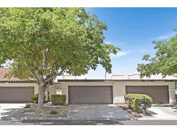 Charming single-story home with mature landscaping, a two-car garage, and a welcoming facade at 2558 La Fortuna Ave, Las Vegas, NV 89121