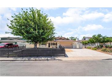 Charming single-story home featuring a well-kept front yard and a spacious driveway leading to an attached garage at 3463 Haverford Ave, Las Vegas, NV 89121