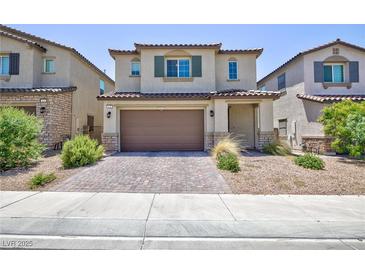 Charming two-story home with a two-car garage and low-maintenance landscaping at 835 Aurelie Ridge St, Henderson, NV 89011