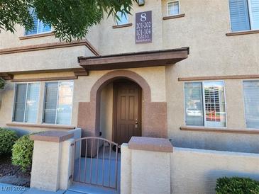 Charming multi-Gathering home with arched entryway and decorative gate at 10231 Deerfield Beach Ave # 104, Las Vegas, NV 89129