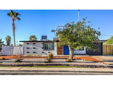 Charming single-story home with landscaped front yard and desert landscaping at 1564 Vegas Valley Dr, Las Vegas, NV 89169