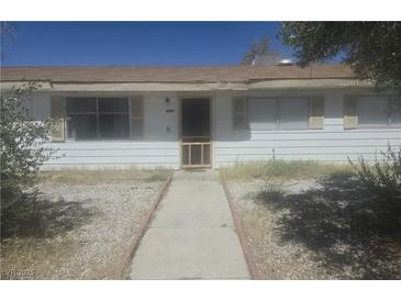 Charming single-story home featuring a well-lit front entrance and a quaint, inviting walkway at 4329 Studio St, Las Vegas, NV 89115