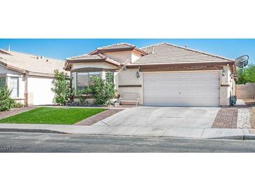 Charming single-story home featuring a two-car garage, well-maintained lawn, and neatly trimmed landscaping at 4529 Gracemont Ave, Las Vegas, NV 89139