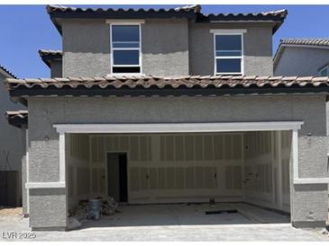 An attached two-car garage offering convenient parking and storage solutions with unfinished drywall at 7341 Daly Grove St, Las Vegas, NV 89113