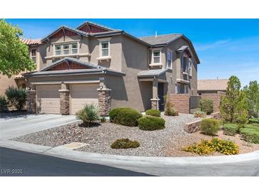 Charming two-story home featuring a two car garage and a beautifully landscaped front yard at 7814 Granite City Ct, Las Vegas, NV 89166