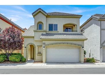 Charming two-story home with a well-maintained lawn and an attached two-car garage at 9225 Dalmahoy Pl, Las Vegas, NV 89145