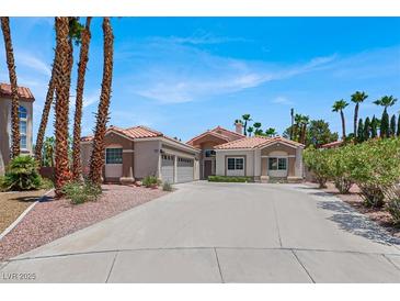 Charming single-story home features a well-manicured yard, desert landscaping, and a spacious driveway at 2102 Rhonda Ter, Henderson, NV 89074