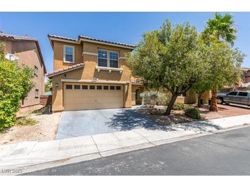 Charming two-story home with a two car garage and manicured front yard landscaping at 212 Stagecoach Flats, Las Vegas, NV 89031