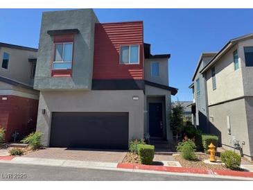 Modern two-story home with attached garage and contemporary design elements at 3194 Lumassina Way, Henderson, NV 89044
