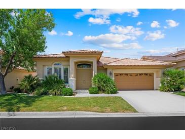 Charming single-story home featuring a well-manicured lawn and attached two-car garage at 2113 Scarlet Rose Dr, Las Vegas, NV 89134
