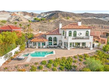 Stunning home features a luxurious pool, spa, and a large patio perfect for outdoor entertaining at 4 Via Vittorio Pl, Henderson, NV 89011