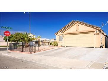 Charming single-story home featuring a spacious driveway and landscaped front yard at 4314 Flaming Ridge Trl, Las Vegas, NV 89147