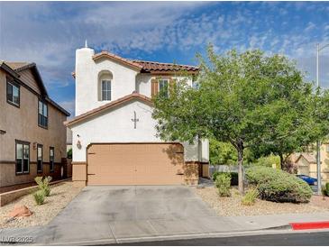 Two-story home with a neutral color scheme, well-maintained landscaping, and an attached two-car garage at 688 Monument Point St, Henderson, NV 89002