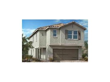 Charming two-story home featuring a tile roof, neutral stucco and a welcoming two-car garage at 9564 Hinson St, Las Vegas, NV 89102