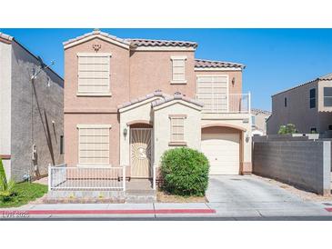 Inviting two-story home with a well-maintained front yard and a charming covered porch entrance at 10414 Midseason Mist St, Las Vegas, NV 89183