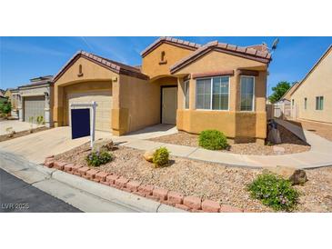 Charming single-story home showcasing xeriscaping, desert landscaping, and an inviting front entrance at 3429 Glacial Lake St, Las Vegas, NV 89122