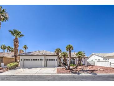 Charming single-story home with a three car garage and well-manicured landscaping at 3693 Miguels Ln, Las Vegas, NV 89120