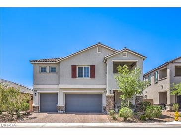 Charming two-story home with a two car garage and well-maintained landscaping in a desirable neighborhood at 3821 Nesting Wren Dr, North Las Vegas, NV 89084