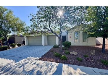 Charming single-story home featuring a three-car garage, a well-maintained yard and mature shade trees at 6614 Collingsworth St, Las Vegas, NV 89131
