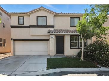 Charming two-story home with a well-manicured lawn and inviting curb appeal at 135 Cadrow Castle Ct, Las Vegas, NV 89148
