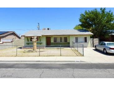 Modest single story home with xeriscaped yard and chain link fence at 2813 Willoughby Ave, Las Vegas, NV 89101