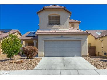 Charming two-story home features a two-car garage and desert landscaping at 3828 Prairie Orchid Ave, North Las Vegas, NV 89081