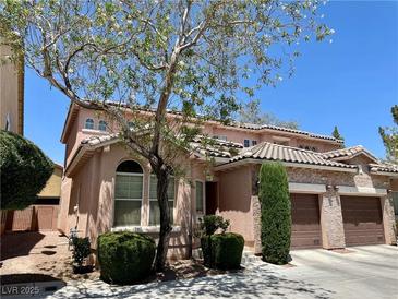 Charming two-story home with a three-car garage and beautiful landscaping at 1169 Via Piazza, Henderson, NV 89052