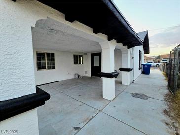 Wide carport featuring white columns with black trim, providing ample covered parking and curb appeal at 3215 Dillon Ave, North Las Vegas, NV 89030